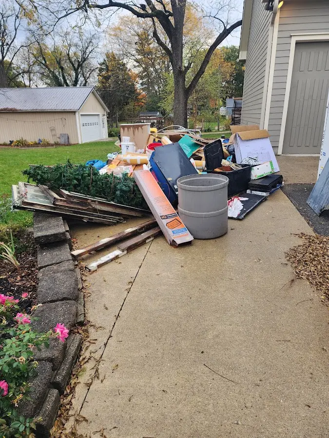 Dumpster being loaded with debris for 30 Yard Dumpster Rental in Andover